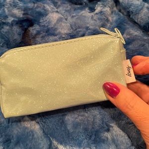 NWOT small Teal color cosmetics bag